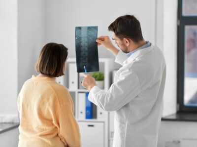 Doctor with spine patient